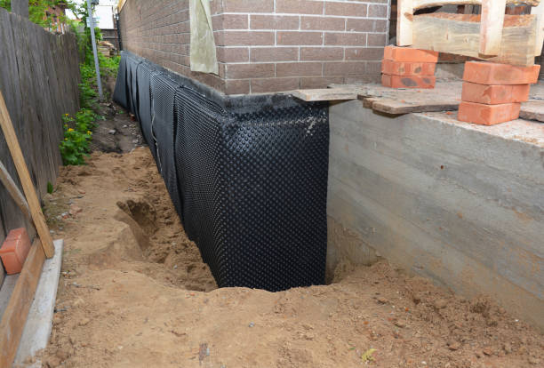 SJ Waterproofing Pros technician performing targeted Waterproofing assessment in Glenwood, NY